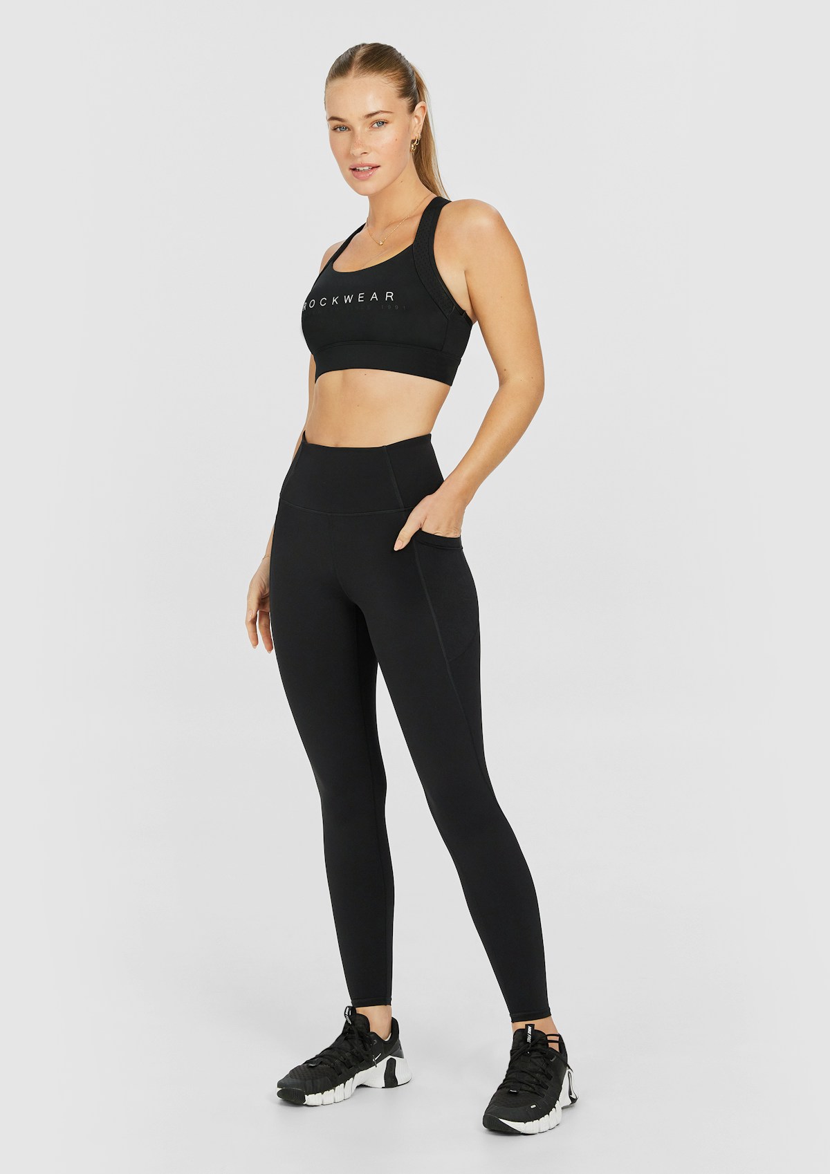 Women's navy biking pants with built-in shelf bra singlet