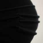 Close-up of black yoga pants scrunch butt pants showing Cashmere Blend fabric texture and stitching detail.