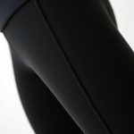 Close-up of high waist leggings black yoga pants showing Merino Wool fabric texture and stitching detail.