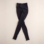Flat lay of charcoal high waisted yoga pants women scrunch bum folded neatly on a neutral surface.