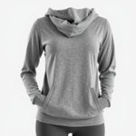 Heather Grey yoga hoodie long sleeve activewear tops on white background, hyperrealistic studio photo.