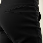 Close-up of black yoga short bike shorts with pockets, showcasing Pima Cotton fabric texture and quality stitching.