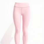 Pastel pink high waisted black pocket leggings for the gym, studio shot on white background.