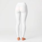 High-waisted white bum scrunch leggings for women, studio photo on pure white background.