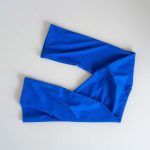 Royal Blue colourful yoga pants for women, folded flat lay on a neutral surface.