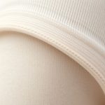 Close-up of the soft cotton yoga pants australia flare legging fabric texture and stitching.