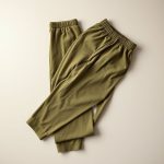 Neatly folded Olive Green cotton yoga pants Australia, part of a womens loungewear set.