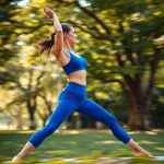 Woman in Royal Blue crop yoga pants performing a yoga pose in an Australian park.