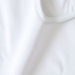 Close-up of eco-friendly cropped yoga pants fabric, highlighting texture and stitching from recycled materials.