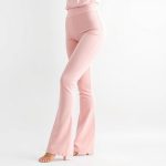 Pastel Pink flare yoga pants for petite women on a clean white background.