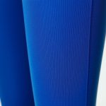 Close-up of blue flare yoga pants womens fabric, showcasing texture, stitching, and high-quality material.