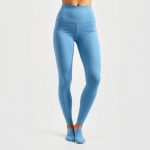 Sky Blue high waisted yoga pants with pockets, activewear leggings on white background, hyperrealistic studio photo.