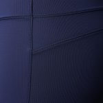 Close-up of high waisted yoga pants fabric, showing texture, stitching, and quality of activewear leggings with pockets.