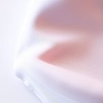 Close-up of now clothing brand australia Luna yoga performance moisture-wicking fabric texture and stitching.
