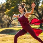 A woman in a now clothing brand australia luna yoga set performing a yoga pose in an Australian park.