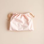 Pastel Pink organic bras yoga bag folded neatly on a neutral surface.