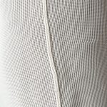 Close-up of linen fabric and stitching on rib flared leggings, highlighting bum-sculpting design and quality material.