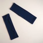 Navy Blue scrunch flare leggings high rise womens leggings folded flat lay on neutral background.