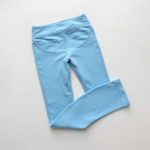 Sky Blue womens leggings with pockets scrunch legging folded neatly on a neutral surface, top-down view.