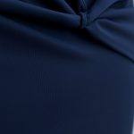 Close-up detail of the navy yoga pants wrap tie top fabric texture and stitching.