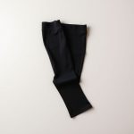 Black yoga crop flare leggings folded flat on a neutral surface.