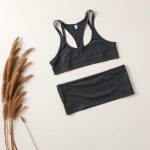 Organic cotton yoga crop top in Charcoal, folded flat on a clean surface.
