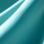 Close-up of the sustainable yoga flared pants fabric texture and stitching detail.