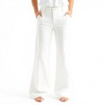 White organic cotton yoga flares on a clean white studio background.