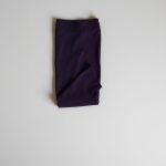Charcoal purple flare yoga leggings folded in a flat lay.