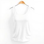 White yoga singlet or yoga t-shirt on a clean white studio background.