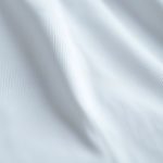 Close-up detail of the soft Pima cotton fabric and stitching on our yoga singlet tshirt.
