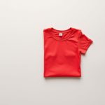 Red yoga tshirt from the active wear flares collection, folded flat on a neutral surface.